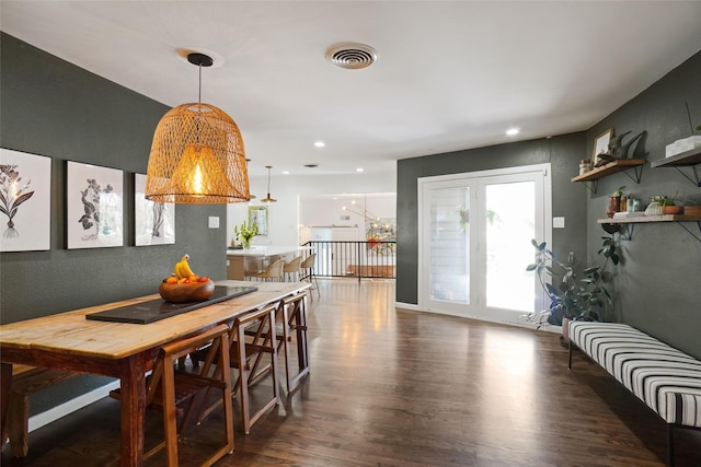 dining space featuring dark wood-type flooring