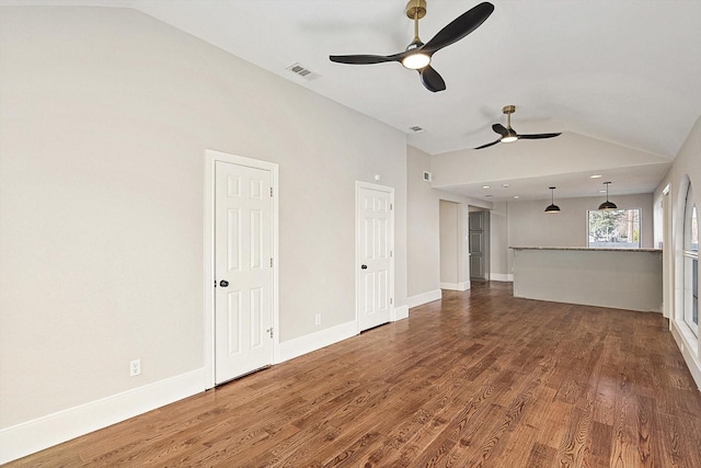 unfurnished living room featuring lofted ceiling, hardwood / wood-style flooring, and ceiling fan