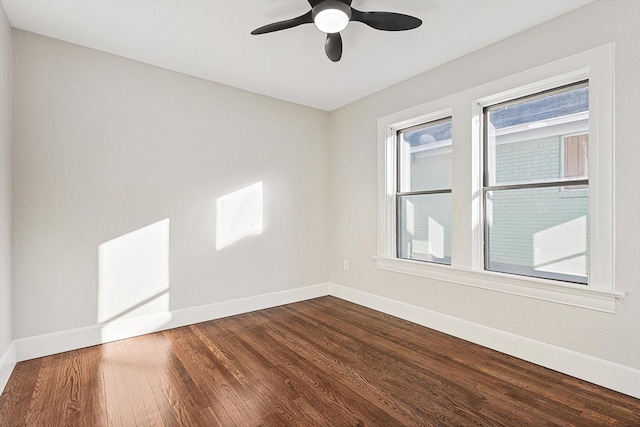 unfurnished room with ceiling fan and wood-type flooring