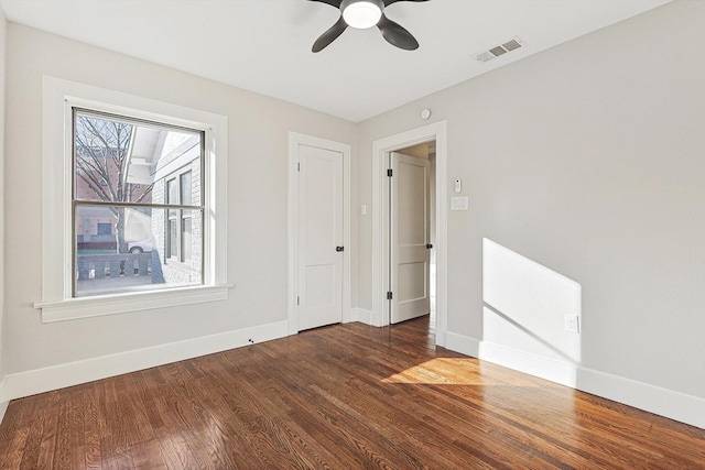 empty room featuring ceiling fan and hardwood / wood-style flooring