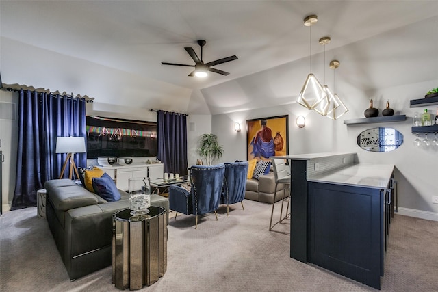 carpeted living room with ceiling fan and vaulted ceiling