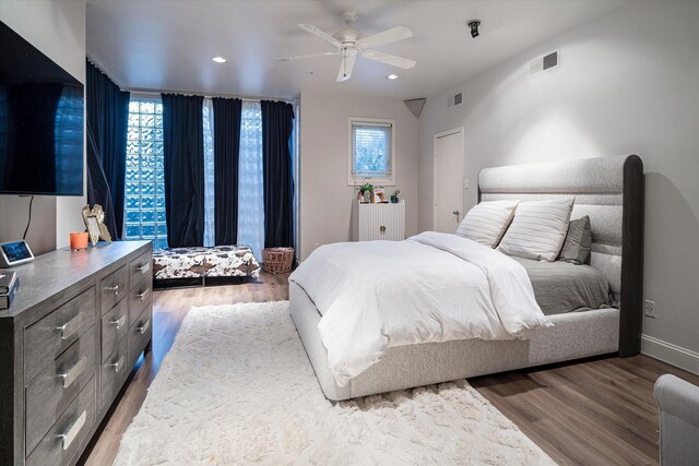 bedroom featuring ceiling fan and wood-type flooring