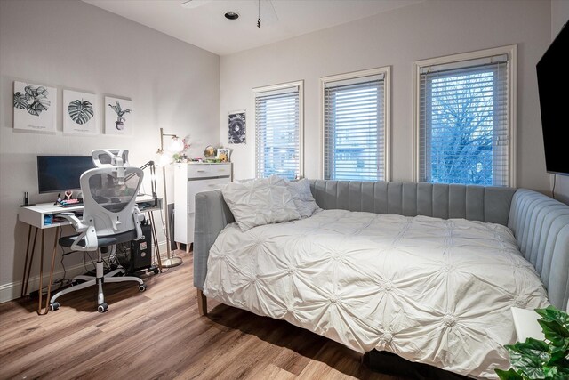 bedroom featuring hardwood / wood-style floors and ceiling fan