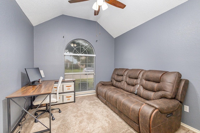 office featuring vaulted ceiling, ceiling fan, a textured ceiling, and light colored carpet