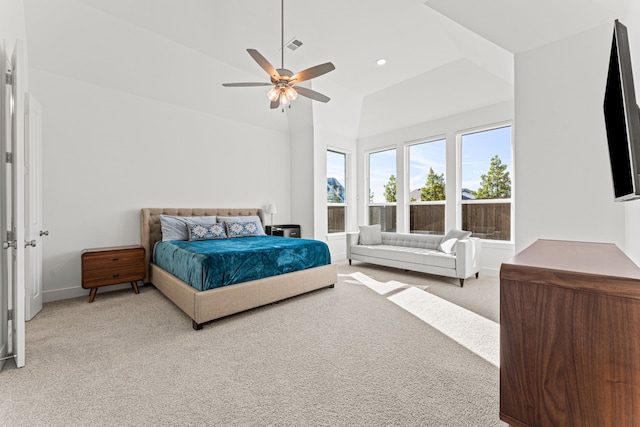 carpeted bedroom with lofted ceiling and ceiling fan