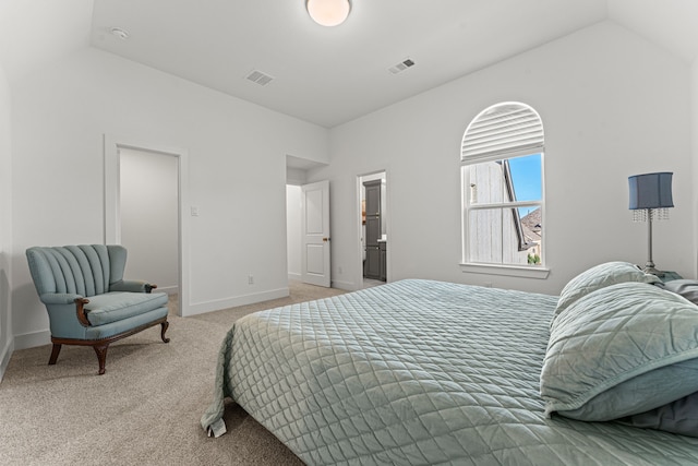 carpeted bedroom featuring vaulted ceiling