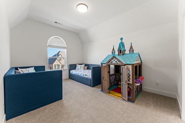 bedroom with lofted ceiling and carpet