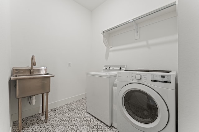 washroom featuring separate washer and dryer and light tile patterned floors