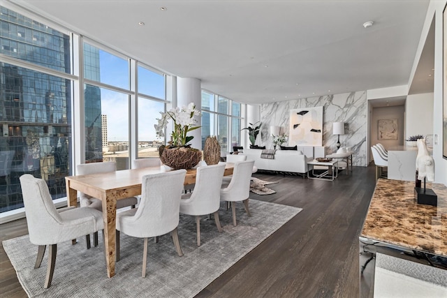 dining space with floor to ceiling windows and dark hardwood / wood-style flooring