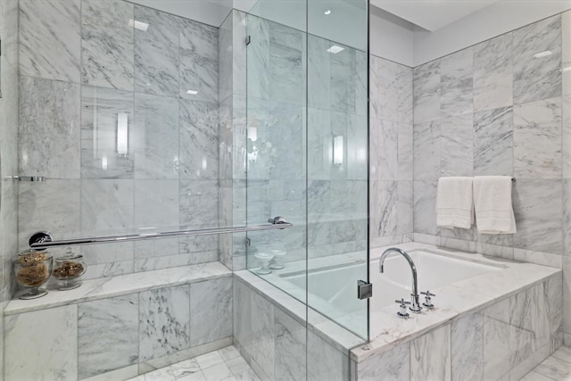 bathroom featuring separate shower and tub