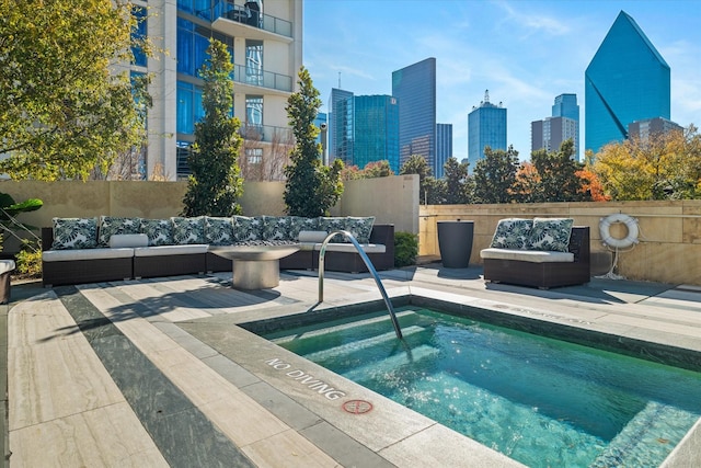 view of pool with a community hot tub, an outdoor hangout area, and a patio area