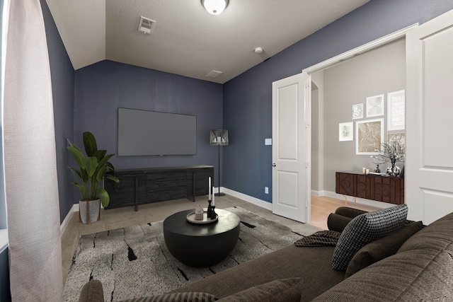 living room featuring lofted ceiling