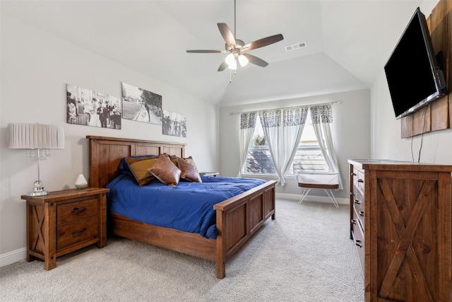 bedroom with vaulted ceiling, light colored carpet, and ceiling fan