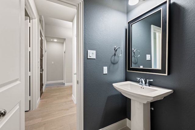 bathroom with wood-type flooring