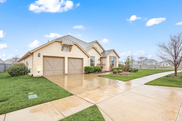 view of front of home with a garage and a front yard