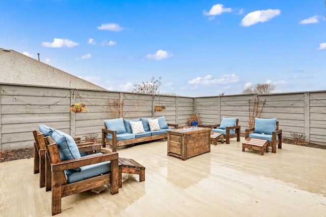 view of patio / terrace featuring an outdoor living space with a fire pit