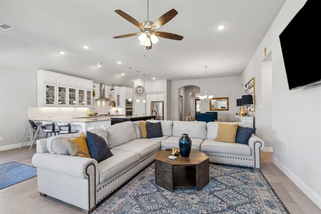 carpeted cinema room with vaulted ceiling