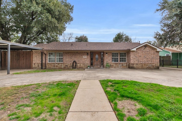 ranch-style home with a carport