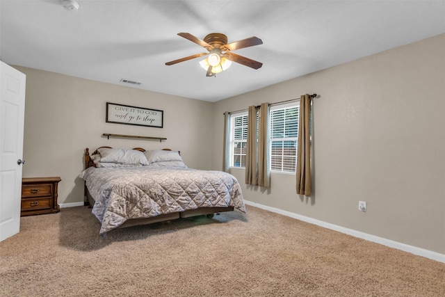 bedroom with ceiling fan and carpet flooring