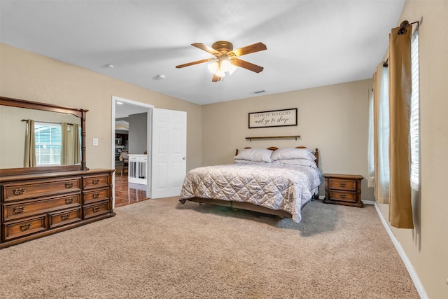 carpeted bedroom featuring ceiling fan