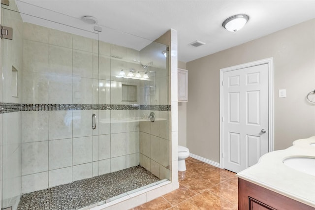 bathroom featuring walk in shower, tile patterned flooring, vanity, and toilet