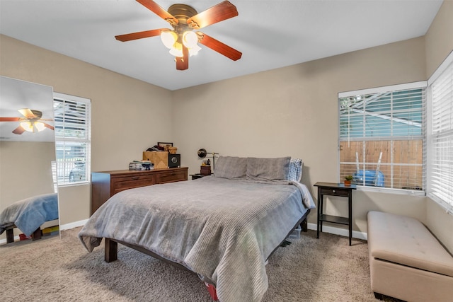 bedroom featuring multiple windows, carpet floors, and ceiling fan