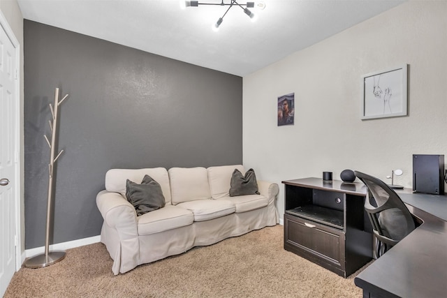 carpeted office with a notable chandelier