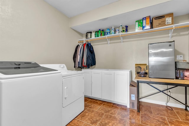 clothes washing area featuring washer and dryer