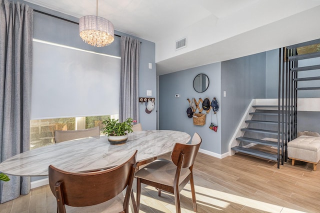 dining area featuring an inviting chandelier