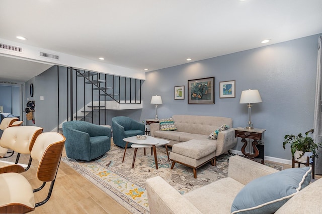 living room with light hardwood / wood-style flooring