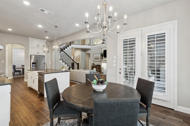 dining room with dark hardwood / wood-style flooring