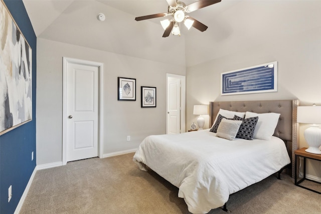 carpeted bedroom featuring ceiling fan and vaulted ceiling