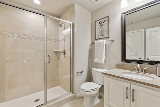 bathroom with toilet, an enclosed shower, and vanity