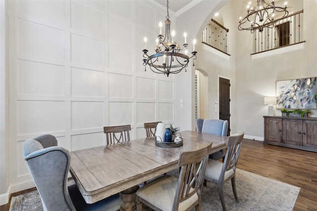 dining room featuring a notable chandelier, crown molding, and dark hardwood / wood-style floors