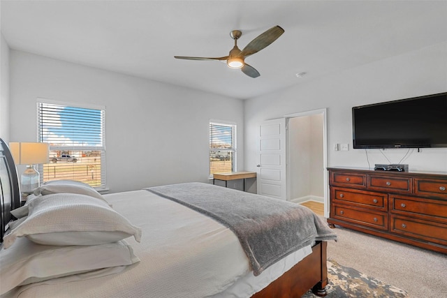 bedroom with light colored carpet and ceiling fan