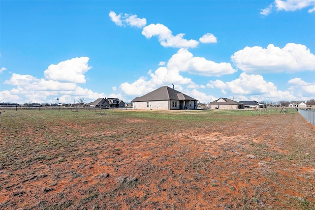 view of yard with a rural view