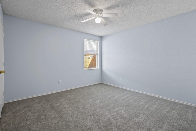 carpeted spare room with ceiling fan and a textured ceiling