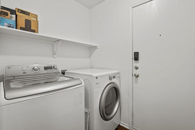 laundry room with independent washer and dryer