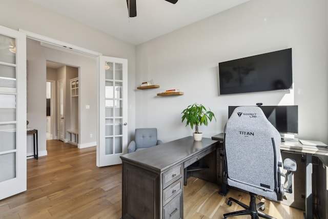 office area with french doors, ceiling fan, and light hardwood / wood-style flooring