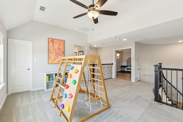 carpeted bedroom featuring vaulted ceiling and ceiling fan