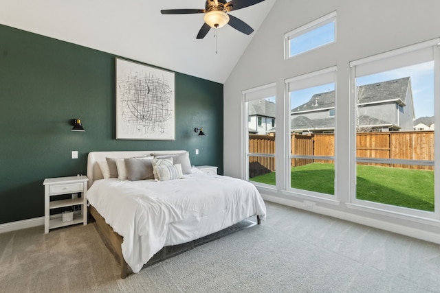 bedroom featuring ceiling fan, high vaulted ceiling, and carpet floors