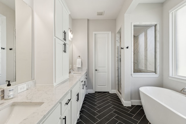 bathroom featuring vanity, tile patterned flooring, and independent shower and bath