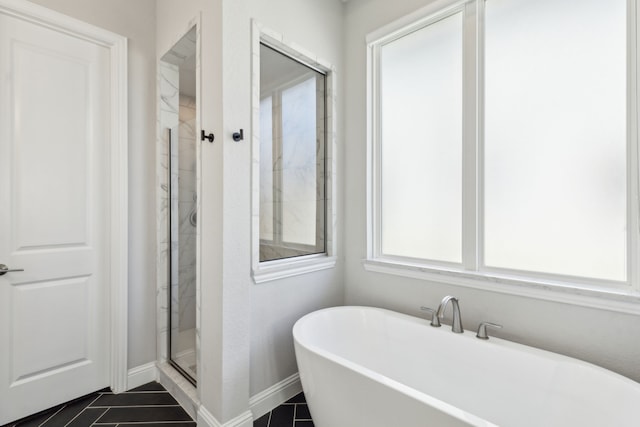 bathroom featuring independent shower and bath and tile patterned floors