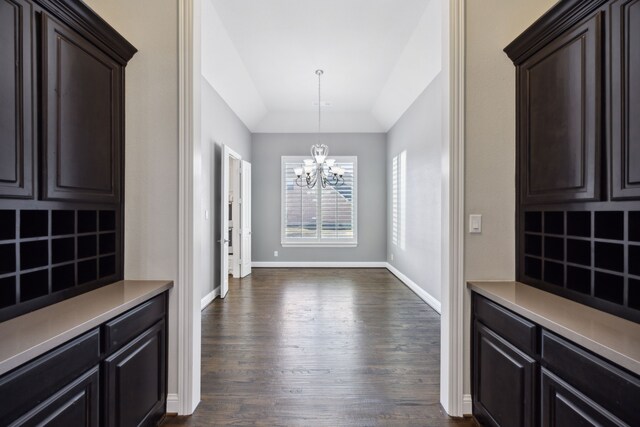 dining room with a chandelier and dark hardwood / wood-style floors