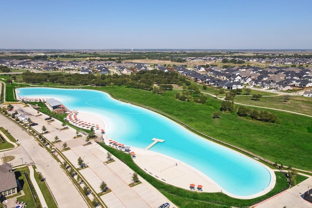 view of swimming pool featuring a residential view