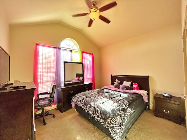 bedroom featuring ceiling fan, light carpet, and vaulted ceiling