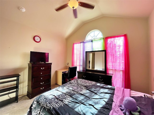 carpeted bedroom featuring vaulted ceiling and ceiling fan