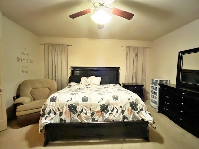 bedroom with ceiling fan and light carpet