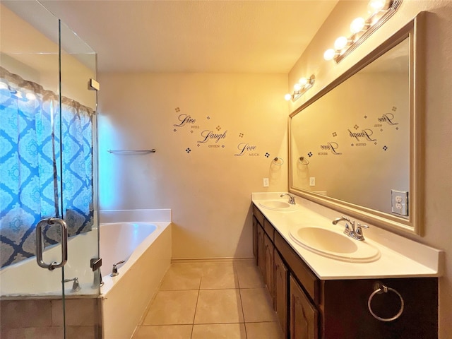 bathroom featuring tile patterned floors, vanity, and shower with separate bathtub