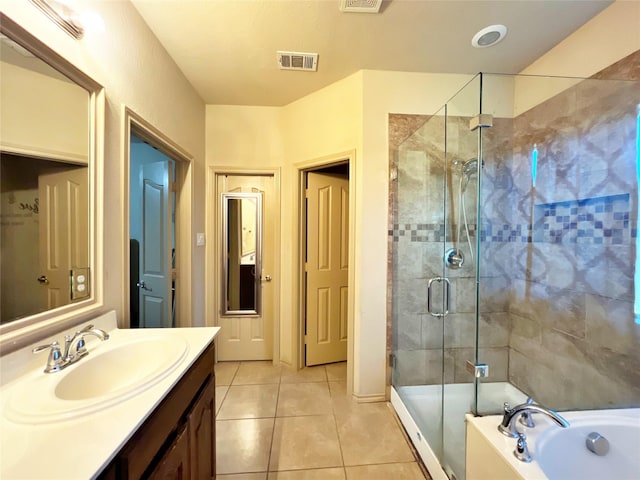 bathroom featuring tile patterned flooring, vanity, and plus walk in shower